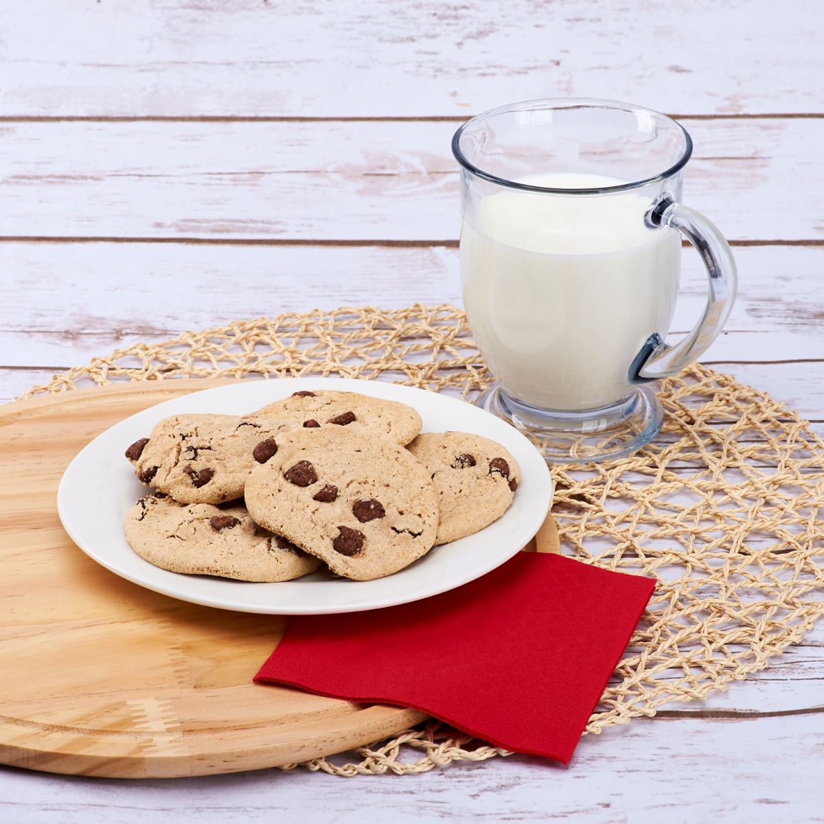 Choco chip cookies and a glass of milk with Karat red beverage napkins