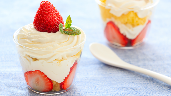 Picture of whipped cream with strawberry on top